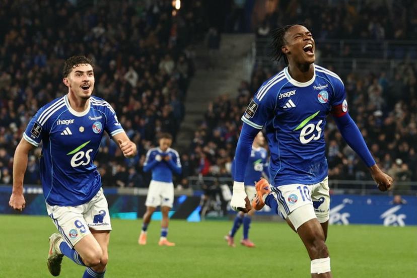 Strasbourg's Dutch forward #10 Emanuel Emegha (R) celebrates with Strasbourg's Argentine forward #09 Joaquin Panichelli after scoring his team's second goal during the French L1 football match between RC Strasbourg Alsace and Lille LOSC at the Stade de la Meinau in Strasbourg, eastern France, on November 9, 2025.  Frederick FLORIN / AFP