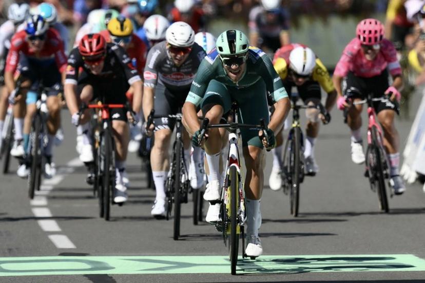 Lidl - Trek team's Italian rider Jonathan Milan wearing the best sprinter's green jersey sprints to the finish line ahead of Team Visma - Lease a bike team's Belgian rider Wout van Aert placing second and Alpecin - Deceuninck team's Australian rider Kaden Groves placing third during the 8th stage of the 112th edition of the Tour de France cycling race, 171.4 km between Saint-Meen-le-Grand and Laval Espace Mayenne, western France, on July 12, 2025.  Marco BERTORELLO / AFP