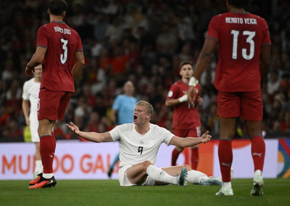Norway's forward #09 Erling Haaland reacts after falling during the UEFA Nations League Group 4 football match between Portugal and Norway at Dragao stadium in Porto on October 3, 2026.   Miguel RIOPA / AFP