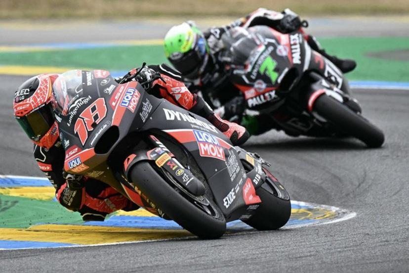 Liqui Moly Dynavolt Itact GP team's Spanish Moto2 rider Manuel Gonzalez, first placed  rides ahead of Fantic Racing Lino Sonego team's Belgian Moto2 rider Barry Baltus second placed in the France Moto2 race at the Le Mans Circuit on May 11, 2025.   LOIC VENANCE / AFP