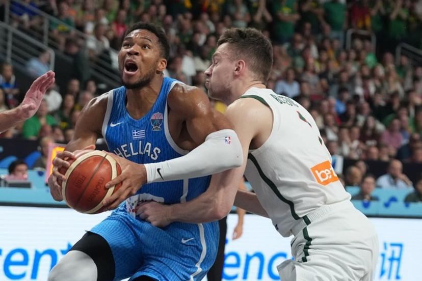 Greece's small forward #34 Giannis Antetokounmpo (L) vies with Lithuania's center #01 Marek Blazevic during the FIBA EuroBasket 2025 basketball quarter final match between Lithuania and Greece at the Arena Riga in Riga, Latvia, on September 9, 2025.  Gints Ivuskans / AFP