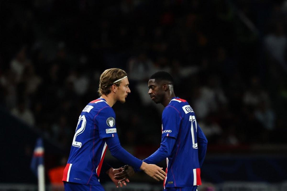 Paris Saint-Germain's French forward #10 Ousmane Dembele (R) leaves the pitch as he is replaced by Paris Saint-Germain's Belgian forward #22 Mika Godts during the UEFA Champions League, league phase, matchday 1, football match between Paris Saint-Germain (PSG) and Slovan Bratislava at the Parc des Princes Stadium in Paris on September 9, 2026.  Anne-Christine POUJOULAT / AFP