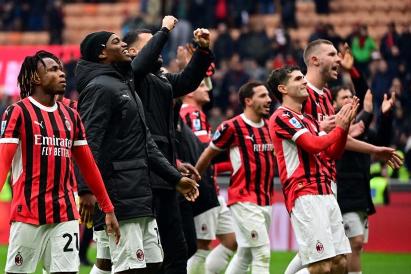 AC Milan's players celebrate after winning the Italian Serie A football match between AC Milan and Parma at the San Siro Stadium in Milan, Italy on January 26, 2025.  Piero CRUCIATTI / AFP