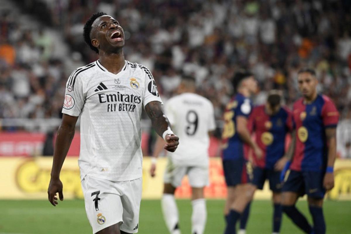 Real Madrid's Brazilian forward #07 Vinicius Junior reacts during their Spanish Cup, Copa del Rey (King's Cup) final football match between FC Barcelona and Real Madrid CF at La Cartuja stadium in Seville on April 26, 2025.  Josep LAGO / AFP