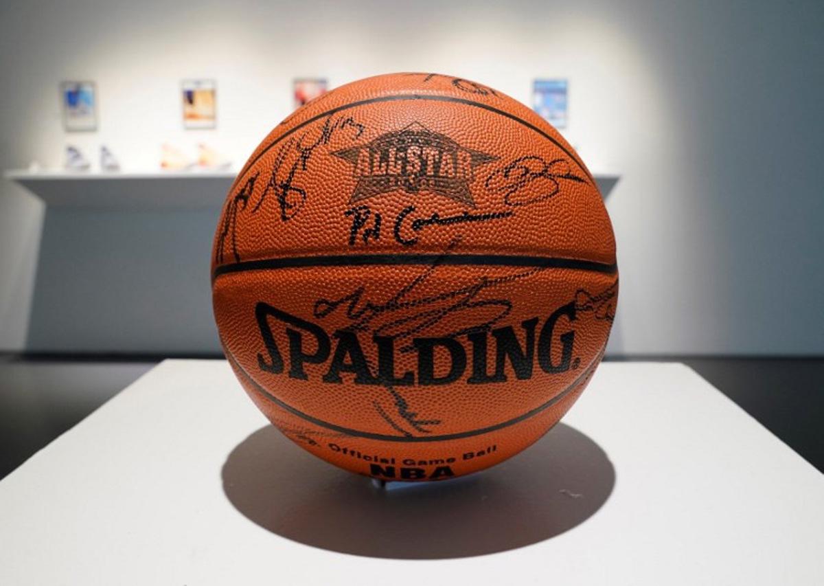A 2005 NBA All-Star game signed basketball is displayed during a press preview at Sotheby's in New York on April 6, 2023 for the upcoming "Victoriam" auction, a special two-part curated collection of sports artifacts.   TIMOTHY A. CLARY / AFP