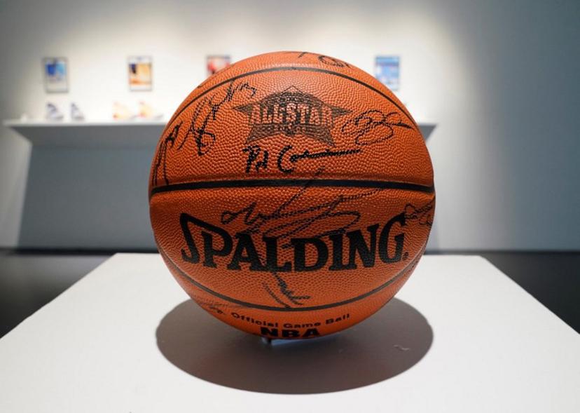 A 2005 NBA All-Star game signed basketball is displayed during a press preview at Sotheby's in New York on April 6, 2023 for the upcoming "Victoriam" auction, a special two-part curated collection of sports artifacts.   TIMOTHY A. CLARY / AFP