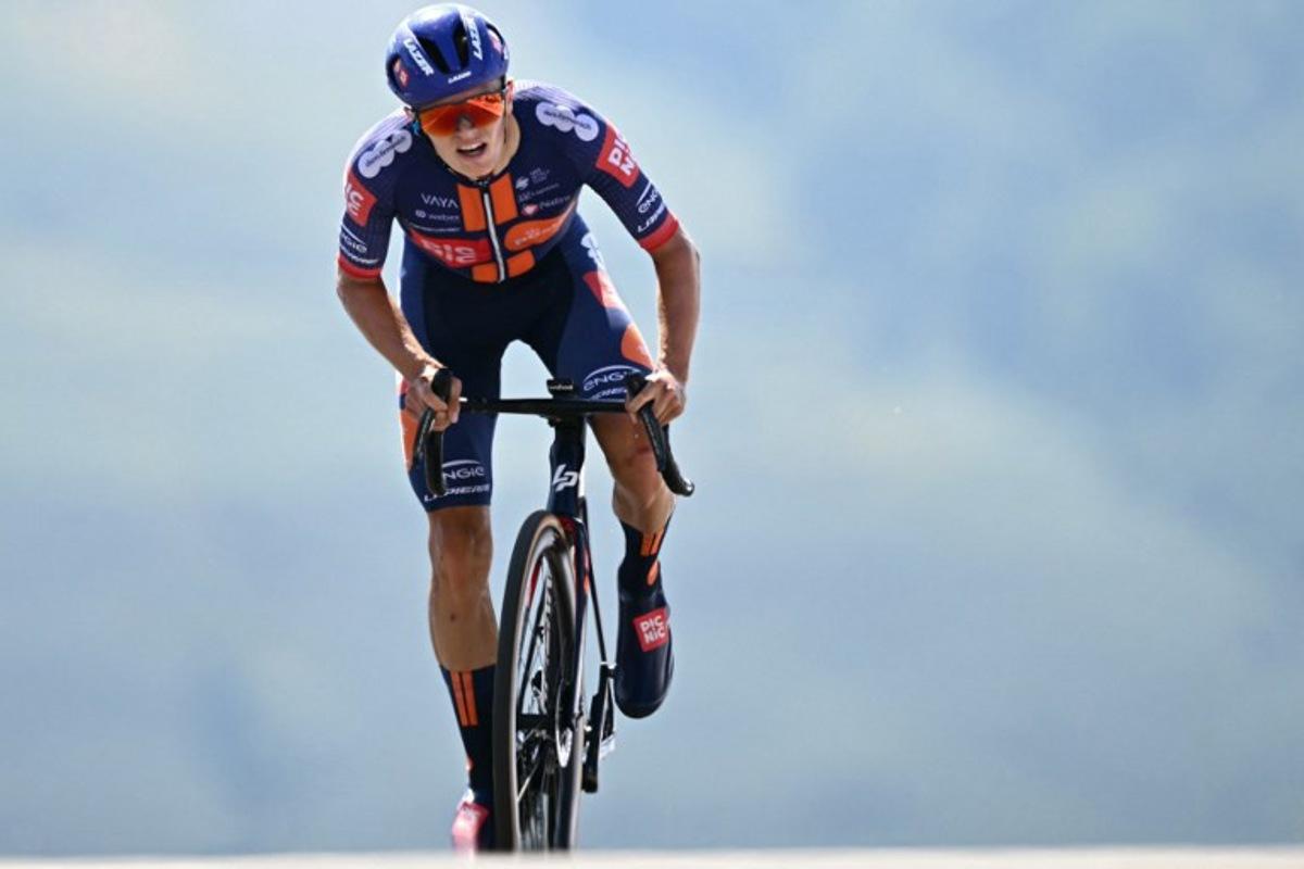 Team Picnic PostNL team's British rider Oscar Onley cycles to the finish line of the 13th stage of the 112th edition of the Tour de France cycling race, 10.9 km individual time trial between Loudenvielle and Peyragudes, in the Pyrenees mountains of southwestern France, on July 18, 2025.  Loic VENANCE / AFP
