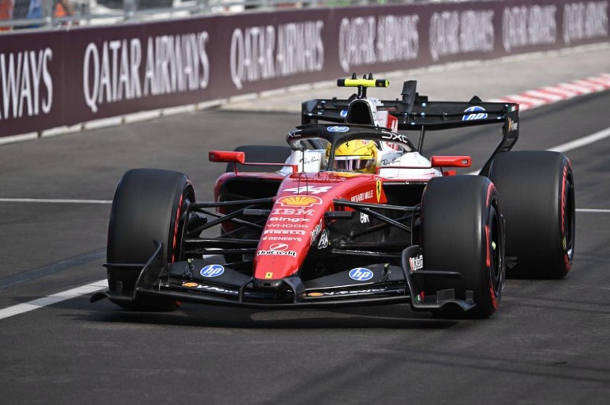 Ferrari's British driver Lewis Hamilton competes during the qualifying session at the Hungaroring racetrack in Mogyorod near Budapest, Hungary, on July 25, 2026 ahead of the Formula One Hungarian Grand Prix.  Attila KISBENEDEK / POOL / AFP