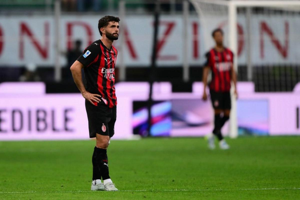 AC Milan's US midfielder #11 Christian Pulisic reacts during the Italian Serie A football match between AC Milan and Udinese at the San Siro stadium in Milan, northern Italy, on April 11, 2026.  MARCO BERTORELLO / AFP