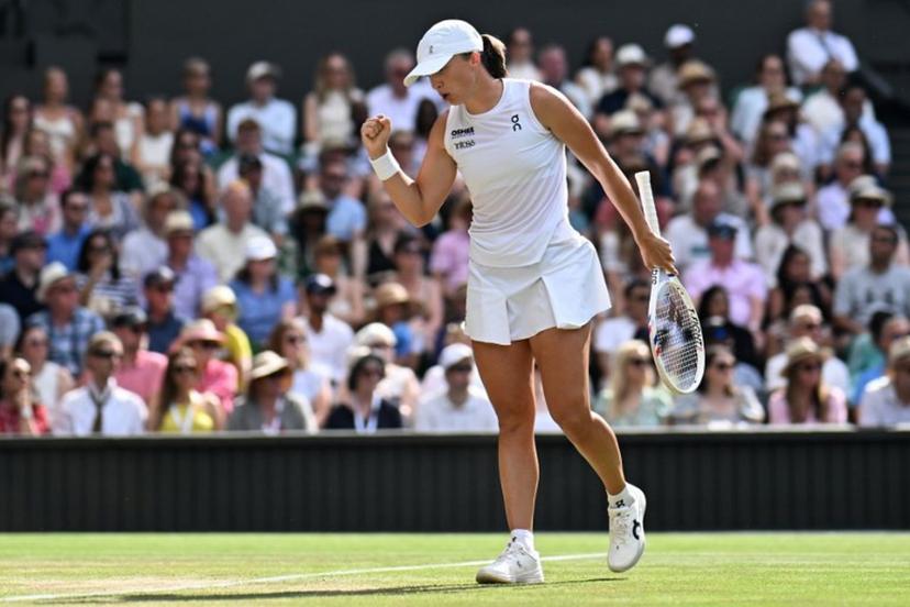 Poland's Iga Swiatek celebrates winning a point against US player Amanda Anisimova during their women's singles final tennis match on the thirteenth day of the 2025 Wimbledon Championships at The All England Lawn Tennis and Croquet Club in Wimbledon, southwest London, on July 12, 2025.  Kirill KUDRYAVTSEV / AFP