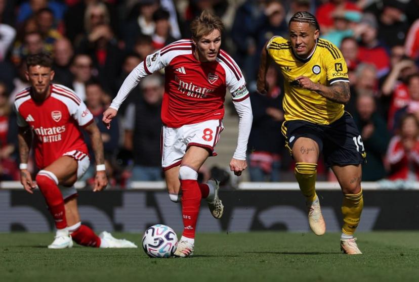 Leeds United's Swiss striker #19 Noah Okafor (R) chases down Arsenal's Norwegian midfielder #08 Martin Odegaard during the English Premier League football match between Arsenal and Leeds United at the Emirates Stadium in London on October 10, 2026.   Adrian Dennis / AFP
