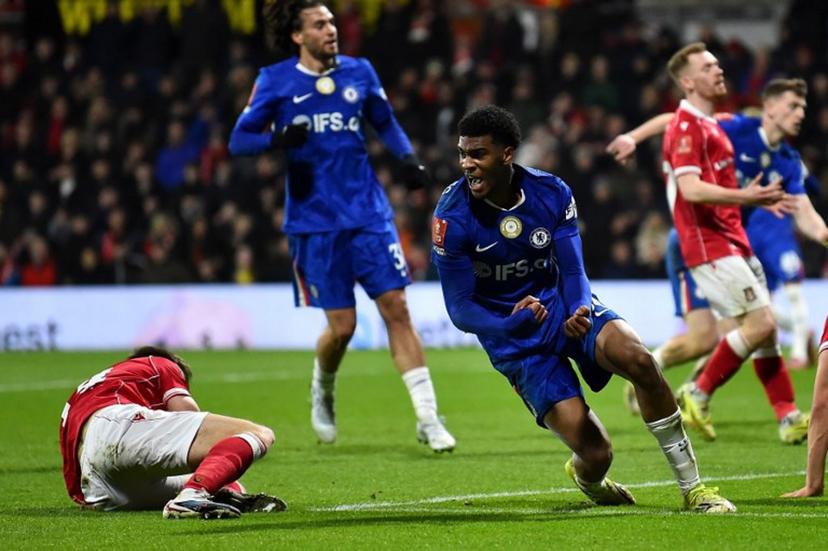 Chelsea's English defender #34 Josh-Kofi Acheampong celebrates scoring the team's second goal during the English FA Cup fifth round football match between Wrexham and Chelsea at the Racecourse Ground Stadium in Wrexham, north Wales, on March 7, 2026.  PETER POWELL / AFP