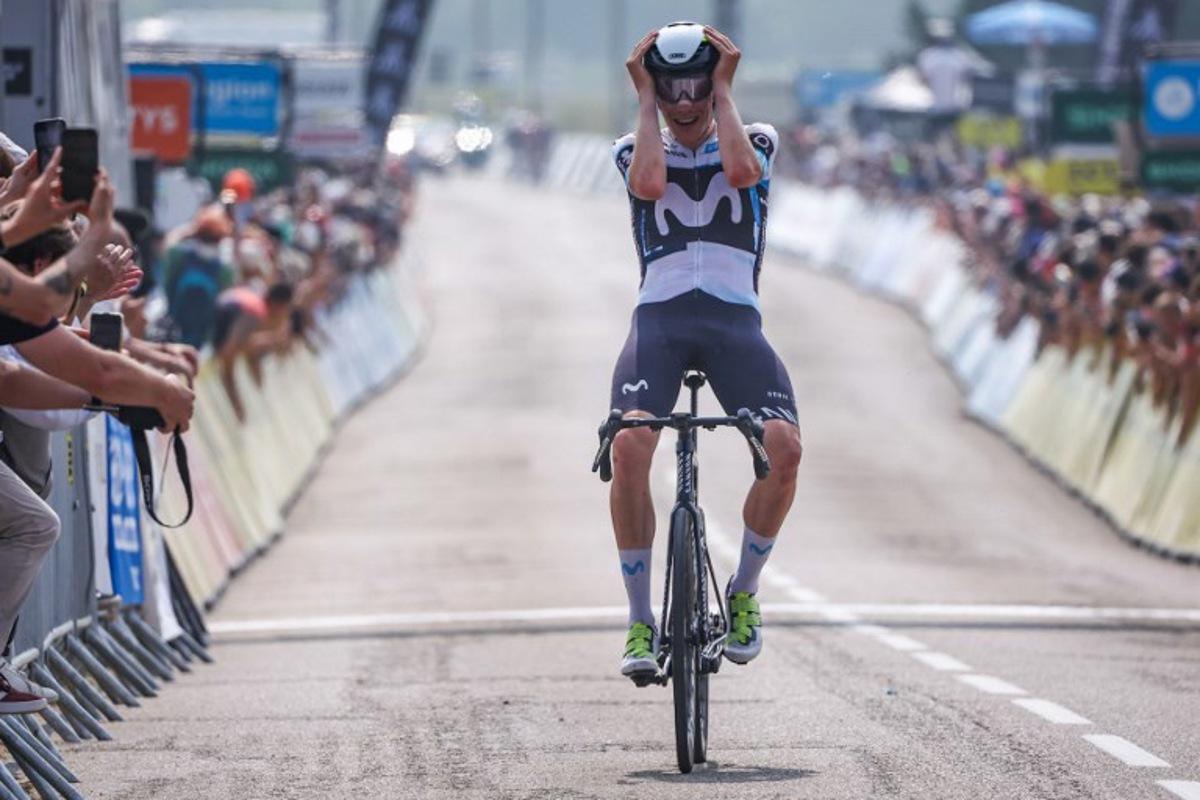 Movistar Team's Spanish rider Ivan Romeo Abad celebrates as he crosses the finish line to win the 3rd stage of the 77th edition of the Criterium du Dauphine cycling race, 207,2 km between Brioude and Charantonnay, on June 10, 2025.  Anne-Christine POUJOULAT / AFP