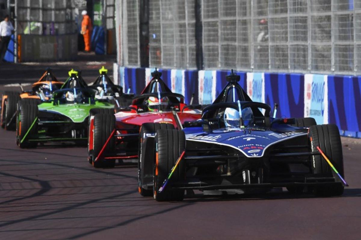 Maserati MSG Racing's driver Maximilian Gunther races ahead of Nissan's driver Sacha Fenestraz (C) and Envision Racing's driver Nick Cassidy (L) during the 2023 Cape Town E-Prix in Cape town on February 25, 2023.  Rodger Bosch / AFP