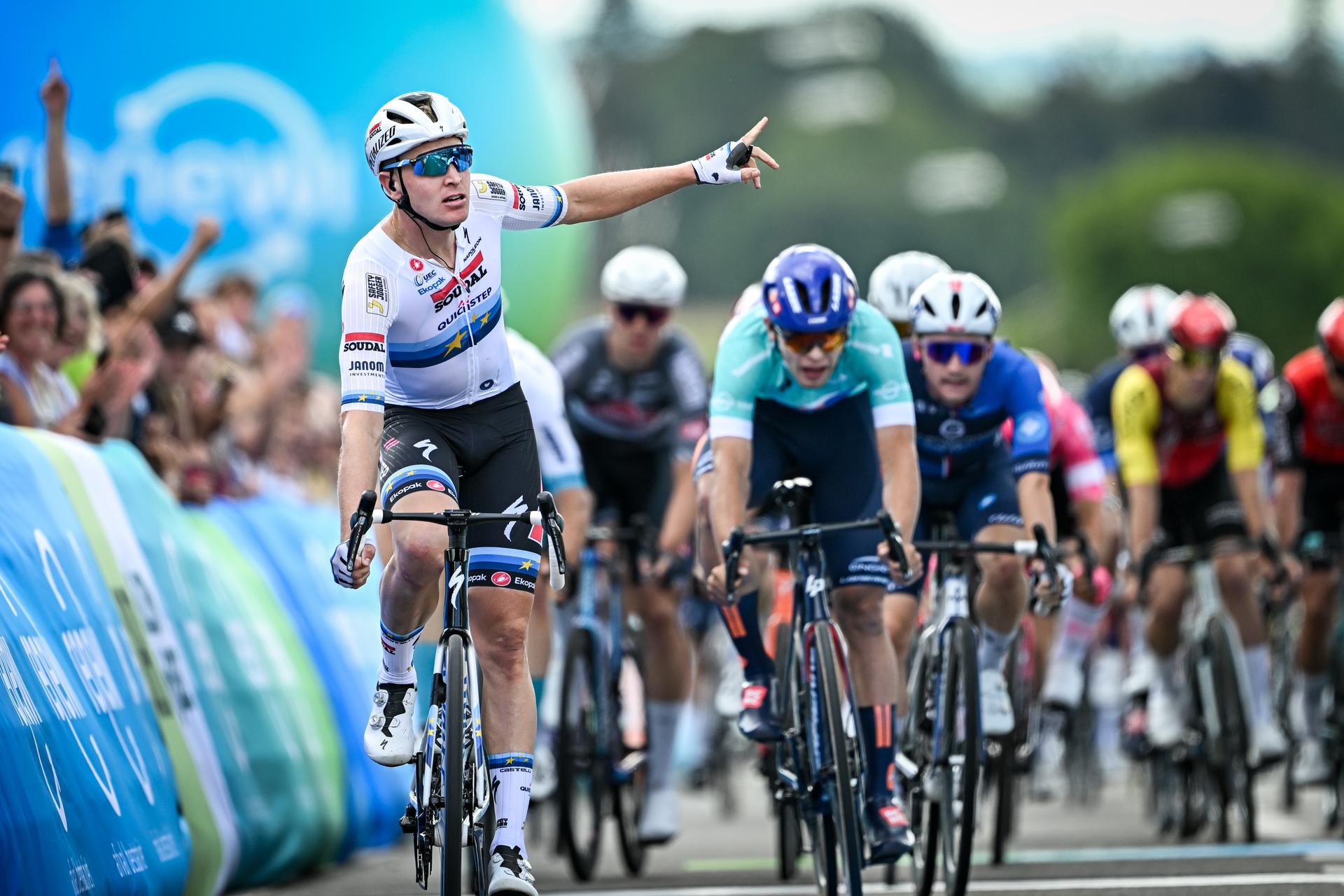 Belgian Tim Merlier of Soudal Quick-Step celebrates as he crosses the finish line to win the fourth stage of the 'Renewi Tour' multi-stage cycling race, from Riemst to Bilzen-Hoeselt (196 km) on Saturday 23 August 2025. The five-day race takes place in Belgium and the Netherlands. BELGA PHOTO DAVID PINTENS