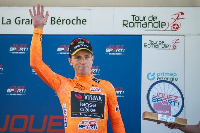 Great Britain's Matthew Brennan wearing the sprint jersey reacts during the podium ceremony of the second stage of the Tour of Romandie UCI cycling World tour, 157km loop from the start to the finish in La Grande Beroche, in Saint-Aubin-Sauges on May 1, 2025.  Fabrice COFFRINI / AFP
