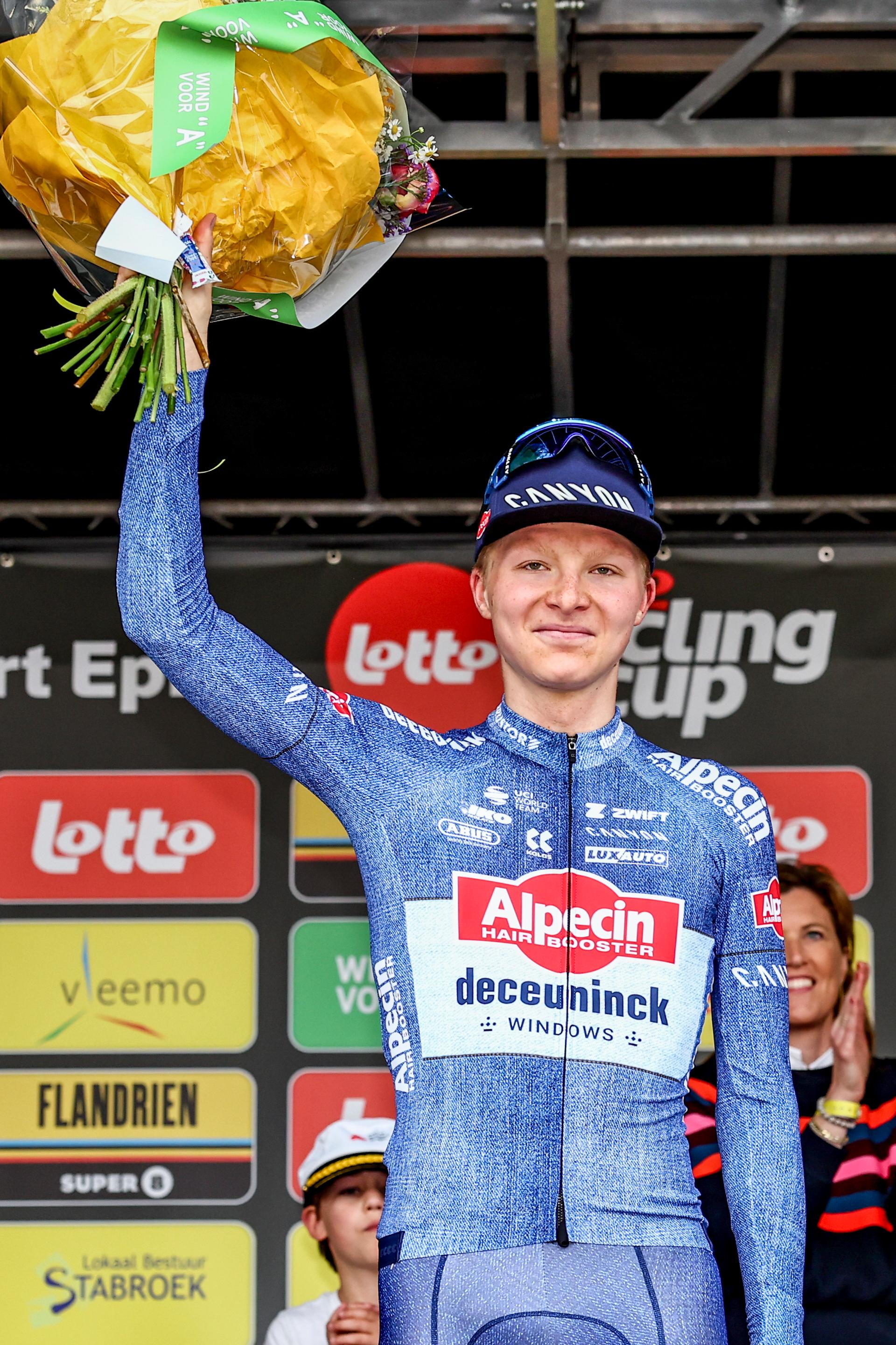 German Juri Hollmann of Alpecin-Deceuninck pictured on the podium after the 'Antwerp Port Epic' 'Schaal Sels' men's elite one day cycling race, 177,9 km in and around Antwerp, fifth race (5/10) in the Lotto Cycling Cup, Sunday 19 May 2024. BELGA PHOTO DAVID PINTENS