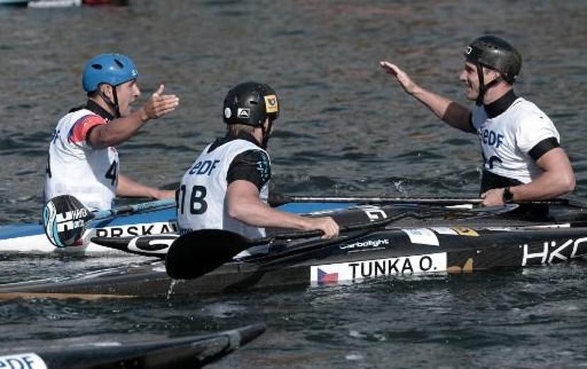 Czech Republic's (from L ) Jiri Prskavec, Tunka Ondrej and Prindis Vit react after they won the Kayak Men Teams final in the Kayak Men Team final at the 2017 ICF Canoe Slalom and Wildwater Canoeing World Championships in Pau, southern France, on September 26, 2017.   IROZ GAIZKA / AFP
