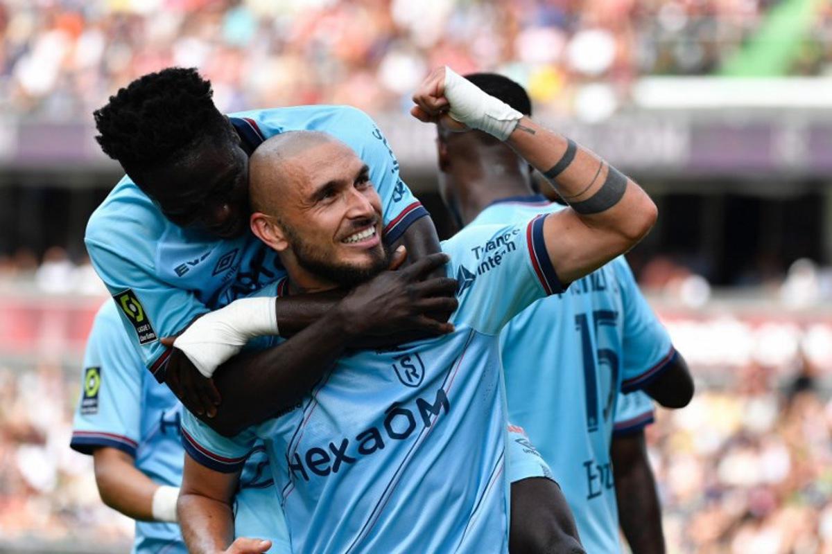 Reims' French midfielder #10 Teddy Teuma celebrates scoring his team's second goal during the French L1 football match between FC Metz and Stade de Reims at the Saint-Symphorien Stadium in Longeville-les-Metz, eastern France, on September 3, 2023.  Jean-Christophe VERHAEGEN / AFP