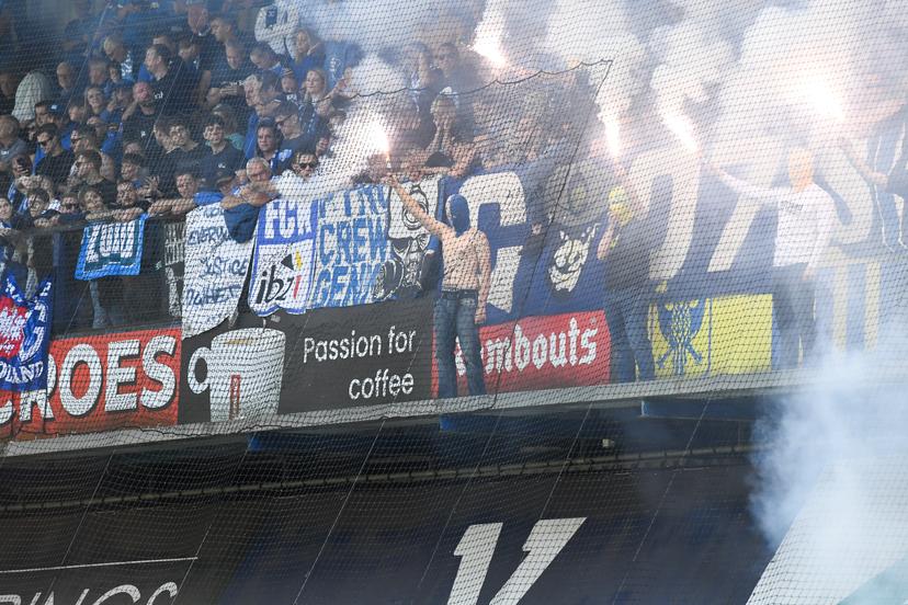 Supporters with fireworks and smoke bombs pictured during a soccer match between Sint-Truidense V.V. and KRC Genk, Sunday 28 September 2025 in Sint-Truiden, on day 9 of the 2025-2026 'Jupiler Pro League' first division of the Belgian championship. BELGA PHOTO JILL DELSAUX