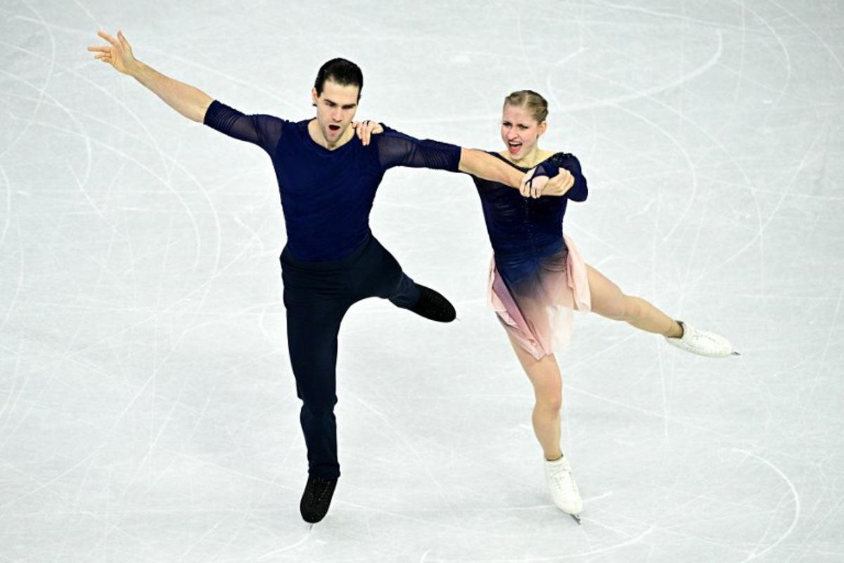 Germany's Minerva Fabienne Hase and Nikita Volodin compete in the figure skating pair skating free skating final during the Milano Cortina 2026 Winter Olympic Games at Milano Ice Skating Arena in Milan on February 16, 2026.  JULIEN DE ROSA / AFP