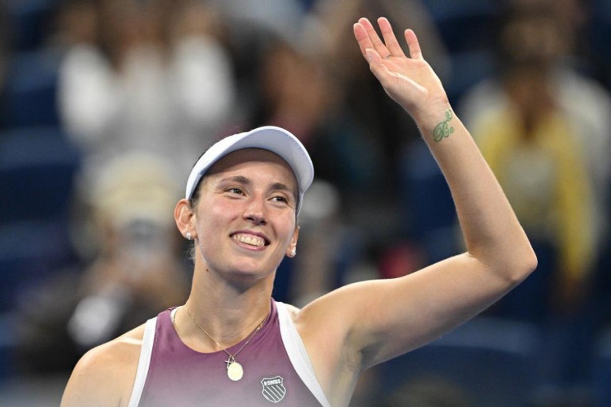 Belgium's Elise Mertens celebrates after beating Poland's Iga Swiatek in their women's singles quarter-final at the China Open tennis tournament in Beijing on October 9, 2026.  GREG BAKER / AFP