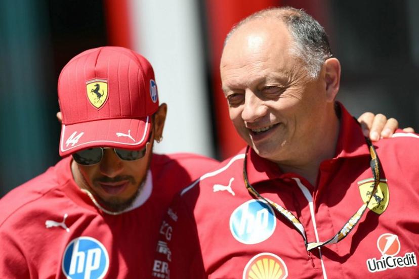 Ferrari's British driver Lewis Hamilton (L) and Ferrari's French team principal Frederic Vasseur speak ahead of the first practice session for the 2025 Emilia Romagna Formula One Grand Prix at the Imola autodrome in Imola, on May 16, 2025.  Marco BERTORELLO / AFP
