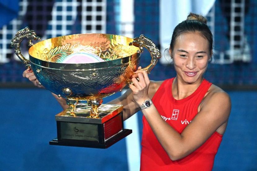 China's Zheng Qinwen celebrates with the trophy after beating Russia's Mirra  Andreeva in the women's singles final at the China Open tennis tournament in Beijing on October 11, 2026.  Greg Baker / AFP