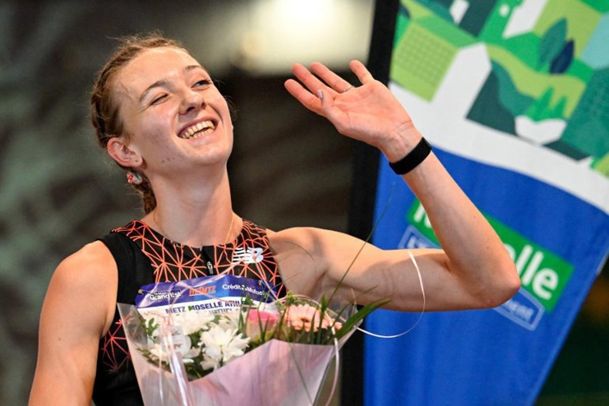 Netherlands' athlete Femke Bol celebrates after winning the women's 800m final during the Athlelor indoor meeting at L'Anneau athletics hall in Metz on February 8, 2026.  On October 10, 2025, Femke Bol announced her retirement from the 400-meter hurdles, the event in which she is a two-time world champion. The 25-year-old athlete then announced her intention to focus on the 800 meters. Jean-Christophe VERHAEGEN / AFP