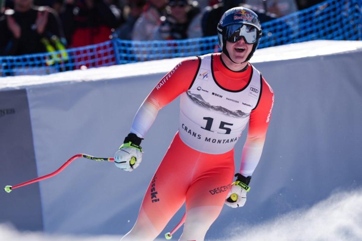 Switzerland's Franjo Von Allmen reacts after crossing the finish line in the men's downhill race part of the FIS Alpine Ski World Cup 2025-2026, in Crans Montana, Switzerland, on February 1, 2026.  Maxime Schmid / AFP