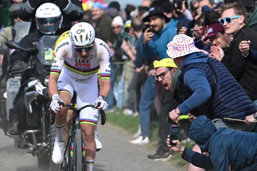 UAE Team Emirates XRG's Slovenian rider Tadej Pogacar cycles in a breakaway on a cobblestone sector during the 123rd edition of the Paris-Roubaix one-day classic cycling race, 258.3 km between Compiègne and Roubaix, northern France, on April 12, 2026.   Bernard PAPON / POOL / AFP