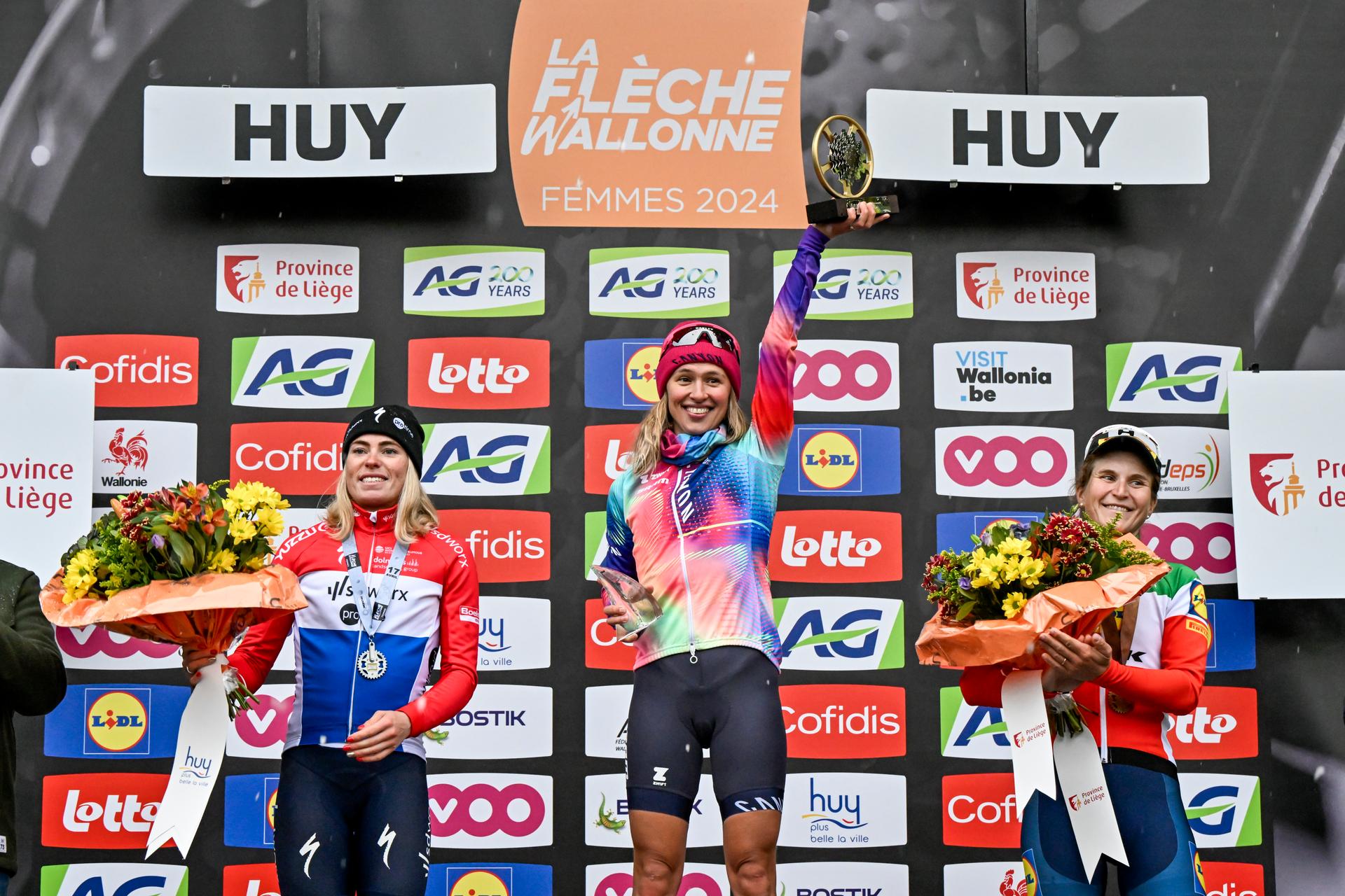 Dutch Demi Vollering of SD Worx - Protime, Polish Katarzyna Niewiadoma of Canyon-SRAM and Italian Elisa Longo Borghini of Lidl-Trek pictured on the podium after the women's race of the 'La Fleche Wallonne', one day cycling race (Waalse Pijl - Walloon Arrow), 146 km with start and finish in Huy, Wednesday 17 April 2024. BELGA PHOTO ERIC LALMAND