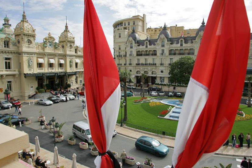 National red-and-white banners fly at half-mast above the Casino square, 13 April 2005 in Monaco, two days before the funeral of Prince Rainier III of Monaco. The prince who ruled the Mediterranean statelet since 1949, died at the age of 81 after a month-long hospitalization with severe breathing and heart problems, 06 April 2005 in the principality.    DOMINIQUE FAGET / AFP