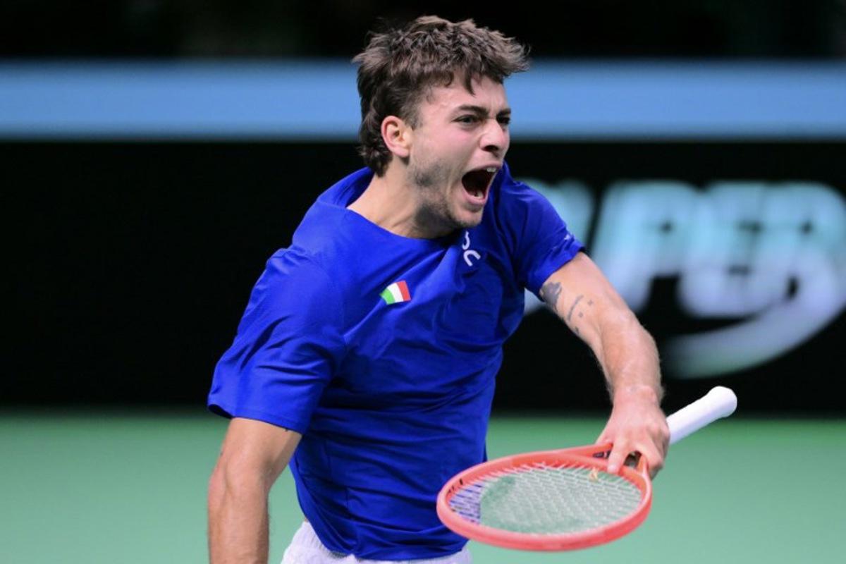 Italy's Flavio Cobolli reacts as he plays against Spain's Jaume Munar Clar during their 2025 Davis Cup men's single final tennis match at the Super Tennis Arena in Bologna, northen Italy, on November 23, 2025.  Tiziana FABI / AFP