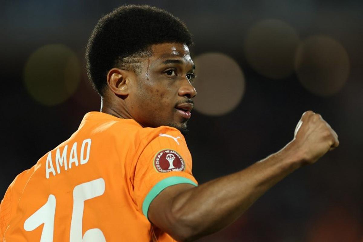 Ivory Coast's forward #15 Amad Diallo celebrates scoring the team's first goal during the Africa Cup of Nations (CAN) round of 16 football match between Ivory Coast and Burkina Faso at the Grand Stadium in Marrakesh on January 6, 2026.   FRANCK FIFE / AFP