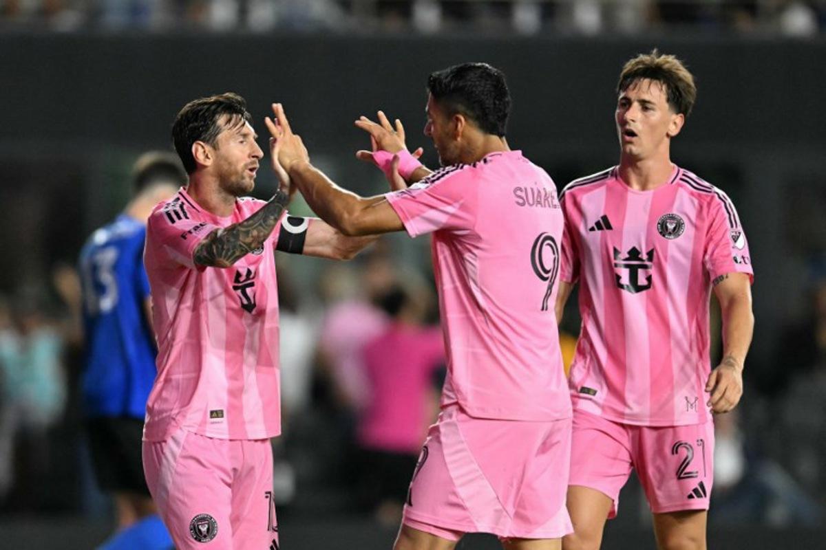 Inter Miami's Uruguayan forward #09 Luis Suarez celebrates scoring his team's second goal with Inter Miami's Argentine forward #10 Lionel Messi (L) during the Major League Soccer match between Inter Miami CF and CF Montreal at Chase Stadium in Fort Lauderdale, Florida, on May 28, 2025.  CHANDAN KHANNA / AFP