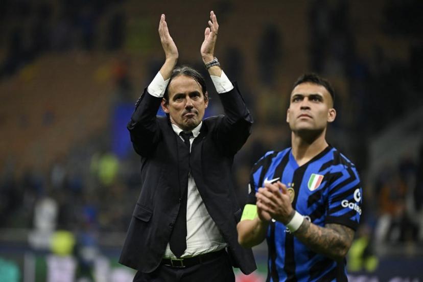 Inter Milan's Italian coach Simone Inzaghi (C) celebrates after Inter Milan won the UEFA Champions League semi-final second leg football match between Inter Milan and FC Barcelona at the San Siro stadium in Milan on May 6, 2025.   PIERO CRUCIATTI / AFP