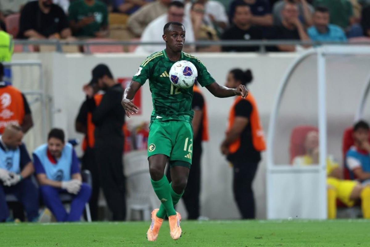 Saudi Arabia's defender #12 Saud Abdulhamid controls the ball during the FIFA World Cup 2026 Asian qualifier football match between Saudi Arabia and Iraq at King Abdullah Sports City in Jeddah on October 14, 2025.  AFP