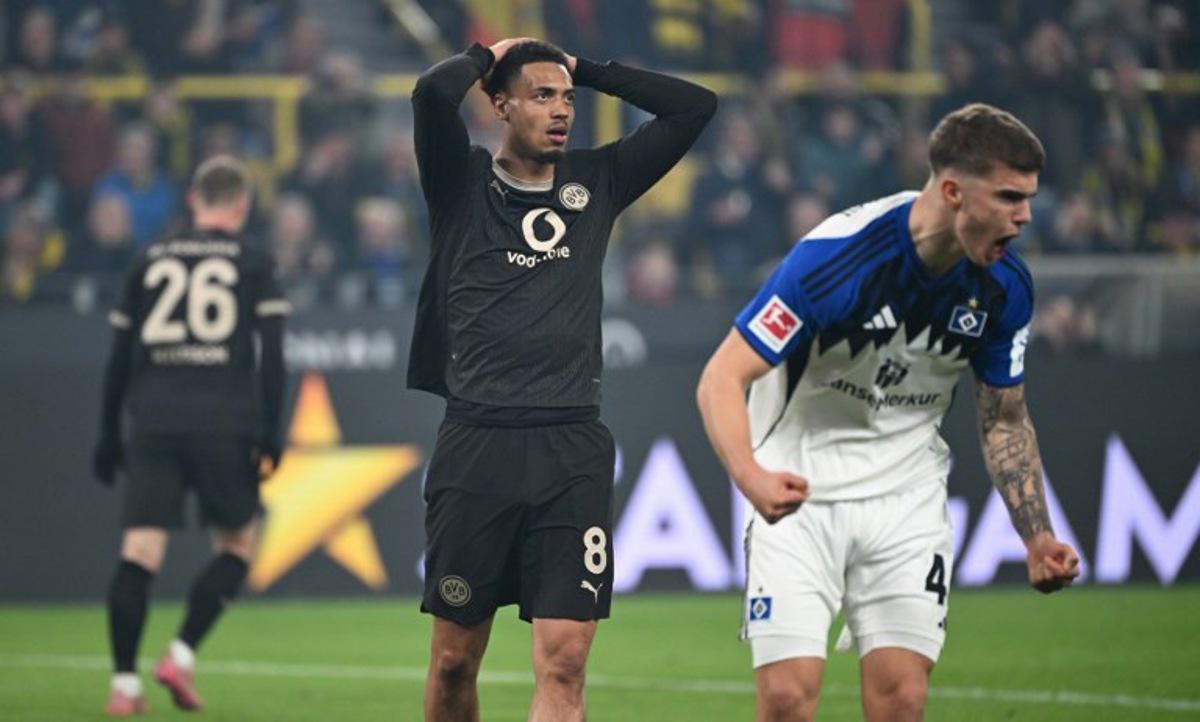 Dortmund's German midfielder #08 Felix Nmecha reacts during the German first division Bundesliga football match between Borussia Dortmund and HSV Hamburg in Dortmund, western Germany, on March 21, 2026.  UWE KRAFT / AFP