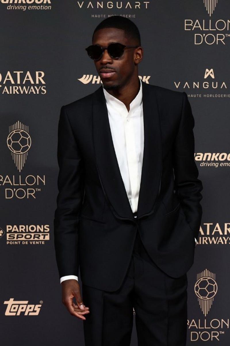 Paris Saint-Germain's French forward Ousmane Dembele poses upon arrival before the 2025 Ballon d'Or France Football award ceremony at the Theatre du Chatelet in Paris on September 22, 2025.  FRANCK FIFE / AFP