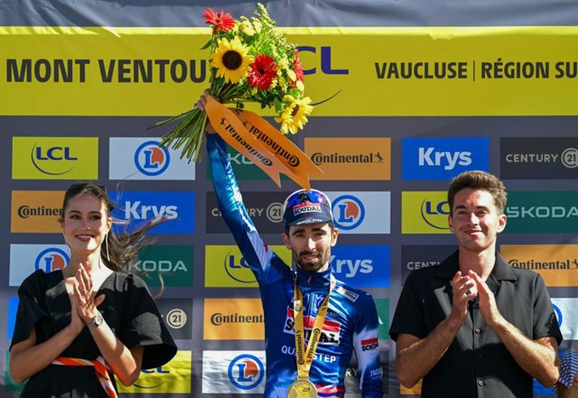 Soudal Quick-Step team's French rider Valentin Paret-Peintre celebrates on the podium after winning the 16th stage of the 112th edition of the Tour de France cycling race, 171.5 km between Montpellier and Mont Ventoux, southern France, on July 22, 2025.  Loic VENANCE / AFP