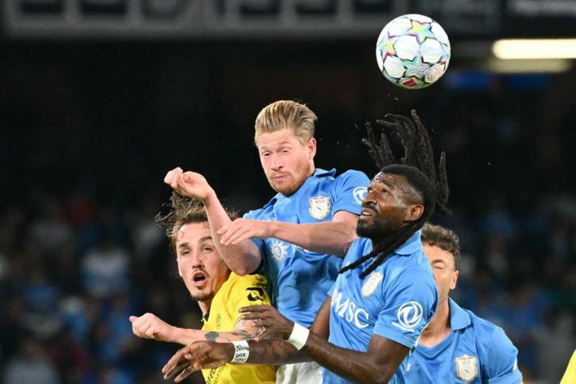 Napoli's Cameroonian midfielder #99 Andre-Frank Anguissa and Napoli's Belgian midfielder #11 Kevin De Bruyne jump for the ball during the UEFA Champions League - first round day 3 football match between Napoli and Bodo Glimt at the Diego Armando Maradona stadium in Naples on October 20, 2026.  Alberto PIZZOLI / AFP