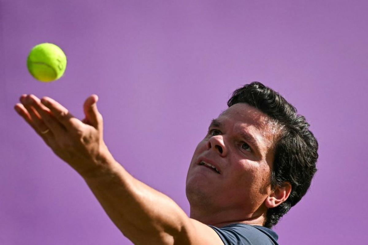Canada's Milos Raonic serves against US player Taylor Fritz during their men's singles round of 16 match at the Cinch ATP tennis Championships at Queen's Club in west London on June 19, 2024.  Ben Stansall / AFP