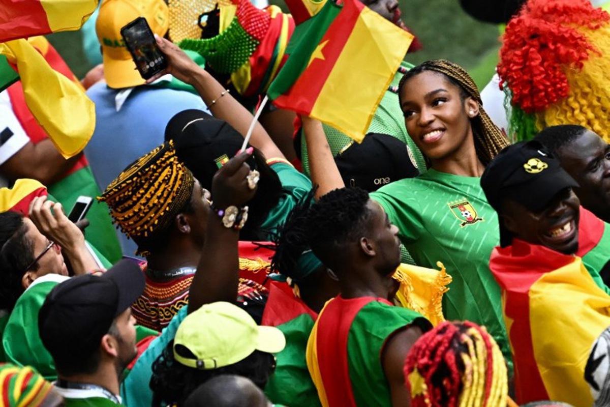 Cameroon's supporters cheer before the start of the Qatar 2022 World Cup Group G football match between Cameroon and Serbia at the Al-Janoub Stadium in Al-Wakrah, south of Doha on November 28, 2022.  Anne-Christine POUJOULAT / AFP