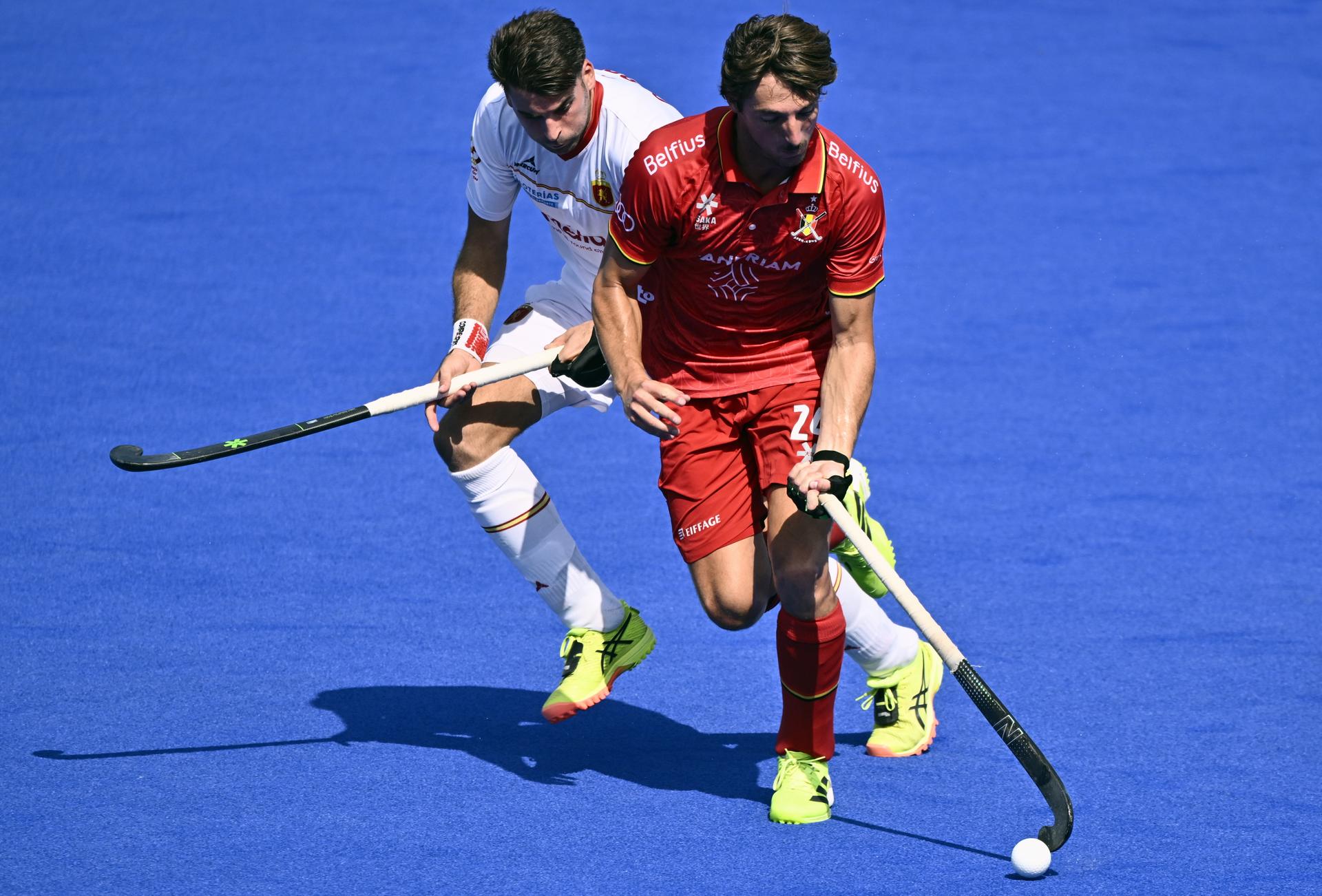 Spanish Marc Reyne and Belgium's Antoine Kina pictured in action during a hockey game between Spain and the Belgian national team Red Lions, match 3/3 in the pool stage of the 2025 men's European championships, Tuesday 12 August 2025 in Monchengladbach, Germany. BELGA PHOTO ERIC LALMAND