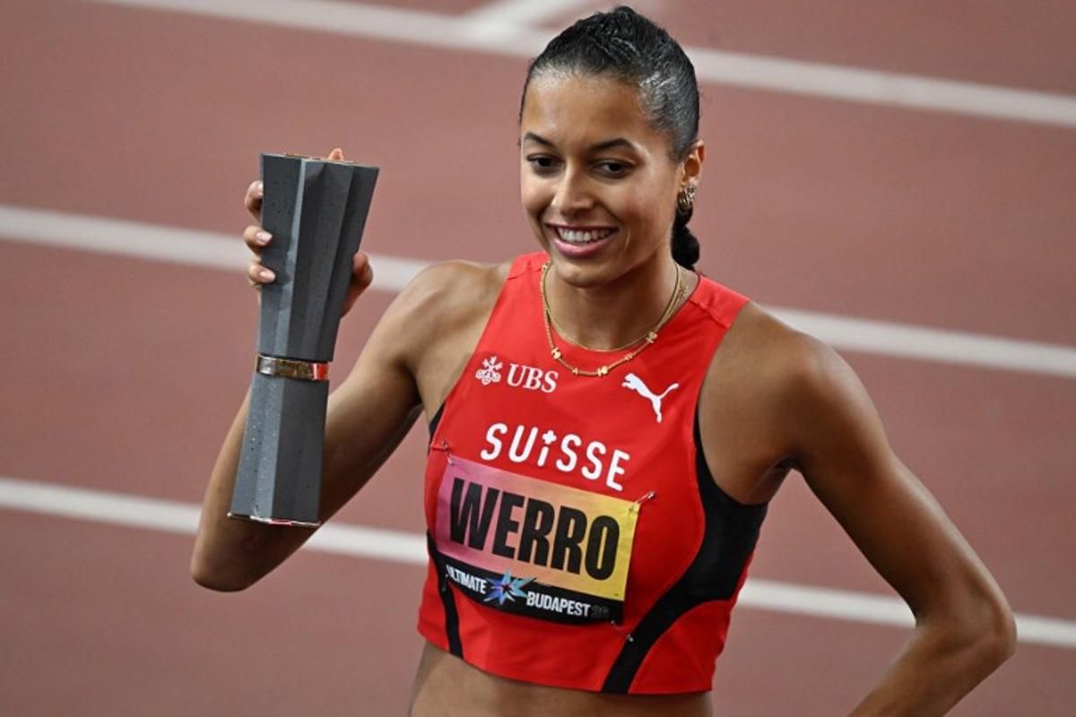 Switzerland's Audrey Werro celebrates with the trophy after winning the women's 800m final during the World Athletics Ultimate Championship at the Gyula Zsivotzky National Athletics Centre, in Budapest on September 12, 2026.  Attila KISBENEDEK / AFP