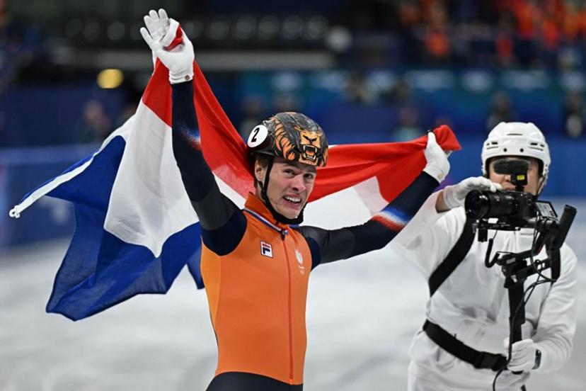 Netherlands' Jens van 't Wout celebrates after winning gold in the short track speed skating men's 1000m final during the Milano Cortina 2026 Winter Olympic Games at Milano Ice Skating Arena in Milan on February 12, 2026.  Gabriel BOUYS / AFP