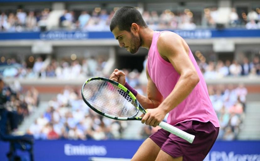 Spain's Carlos Alcaraz reacts to a point to Serbia's Novak Djokovic during their men's singles semifinal tennis match on day thirteen of the US Open tennis tournament at the USTA Billie Jean King National Tennis Center in New York City, on September 5, 2025.  ANGELA WEISS / AFP