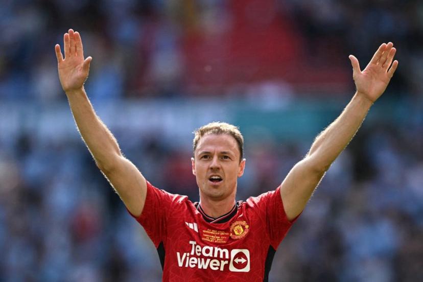 Manchester United Northern Irish defender #35 Jonny Evans celebrates after winning the English FA Cup final football match between Manchester City and Manchester United at Wembley stadium, in London, on May 25, 2024. Manchester United wins 2 - 1 against Manchester City. Ben Stansall / AFP
