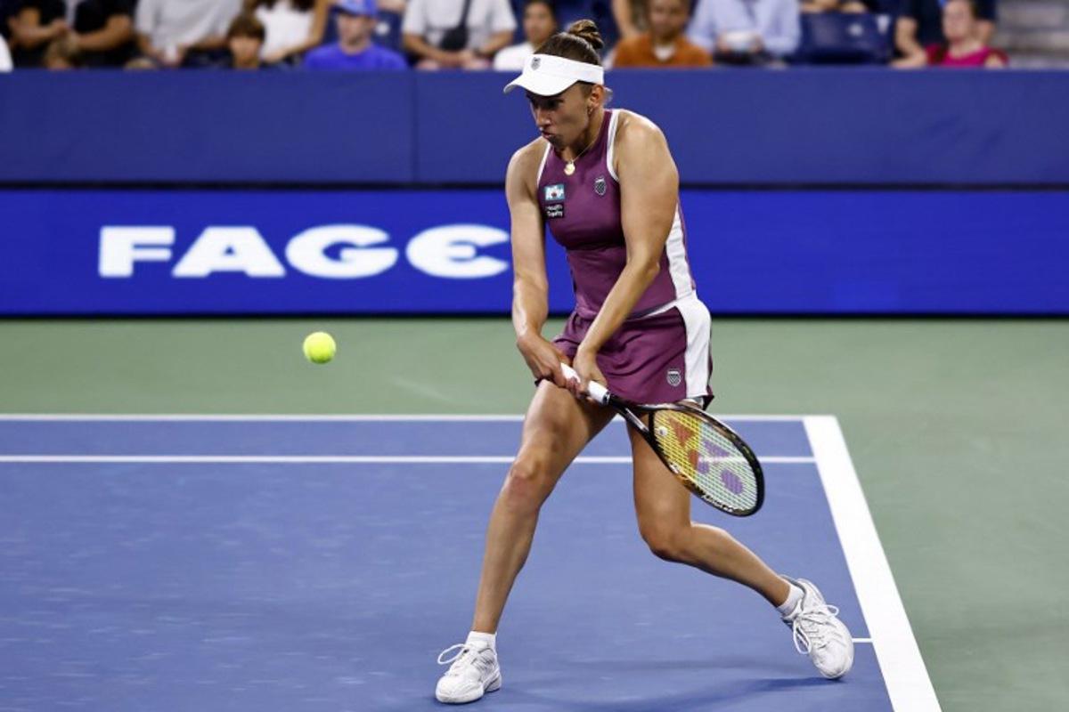Belgium's Elise Mertens hits a return to Japan's Naomi Osaka in their women's singles third round tennis match on day seven of the US Open tennis tournament at the USTA Billie Jean King National Tennis Center in New York City on September 5, 2026.  kena betancur / AFP